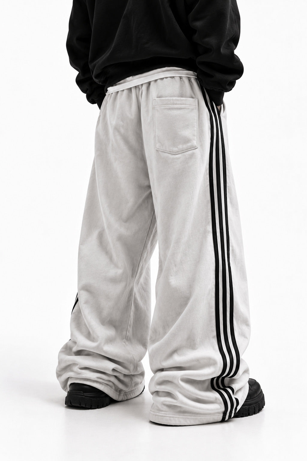 Drift Track Pants Bone, worn, back view, with the back patch pocket